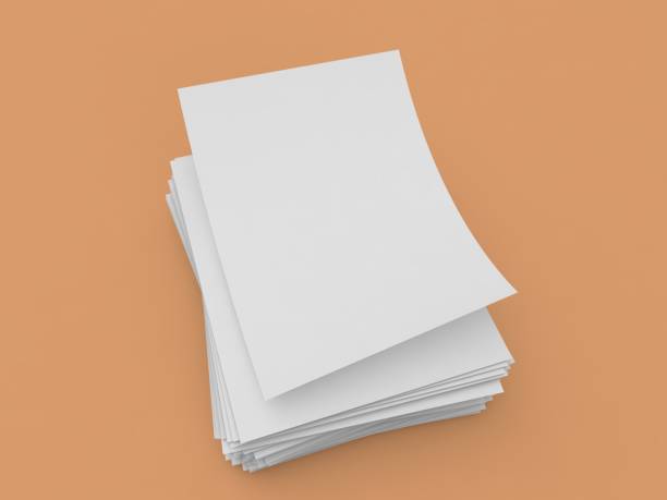 istock White sheets of A4 office paper on a brown background. 1460313820