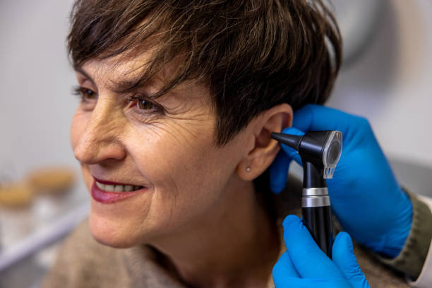 istock ENT doctor examining an elderly female patient 1460314856