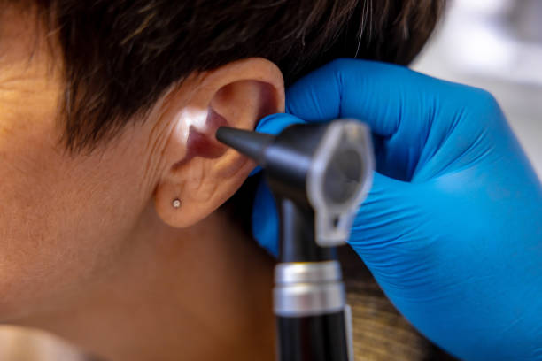 istock ENT doctor examining an elderly female patient 1460314882