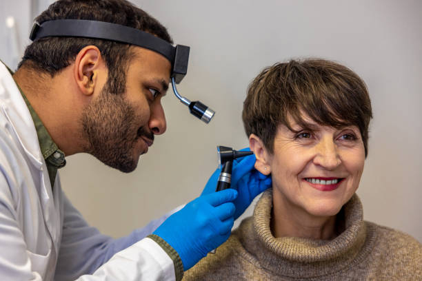 istock ENT doctor examinine patients ear with endoscope 1460314929
