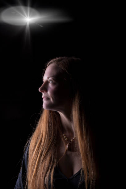 istock young woman resting by a fireplace 1460318096