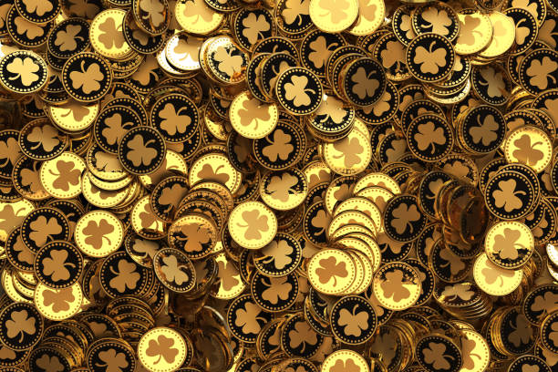 St. Patrick's Day. Treasure, lot of golden coins with shamrock symbol stock photo