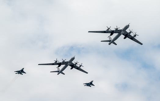 July 31, 2022, St. Petersburg, Russia.  Tupolev Tu-142M3 long-range anti-submarine defense aircraft and Mikoyan MiG-29K carrier-based fighters at the Main Naval Parade in honor of the Russian Navy Day in St. Petersburg.