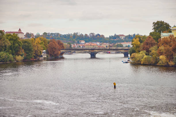 istock Famous Prague bridges in autumn 1460324659