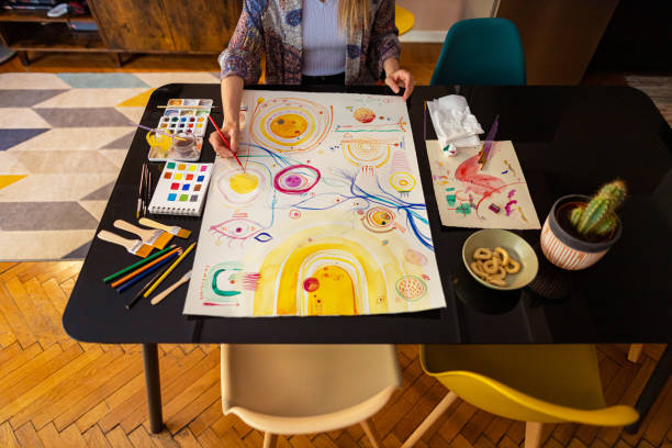 istock Unrecognizable female artist making strokes on paper 1460325420