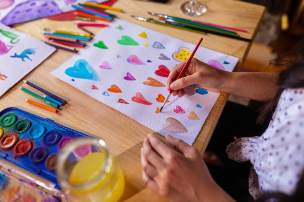 istock Painting hearts on the paper with aquarelle technique 1460326913