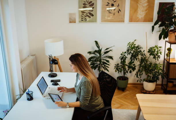 istock Woman working from home, hybrid workspace 1460328185