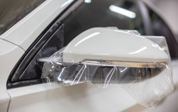 istock The process of installing PPF on the side mirror. PPF is a protective film for paint that protects the paint from scratches and gravel.Anti-gravity protection. PFF is installed. 1460329200