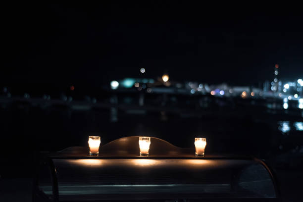 istock Table with candles on the beach of the evening cafe 1460331522