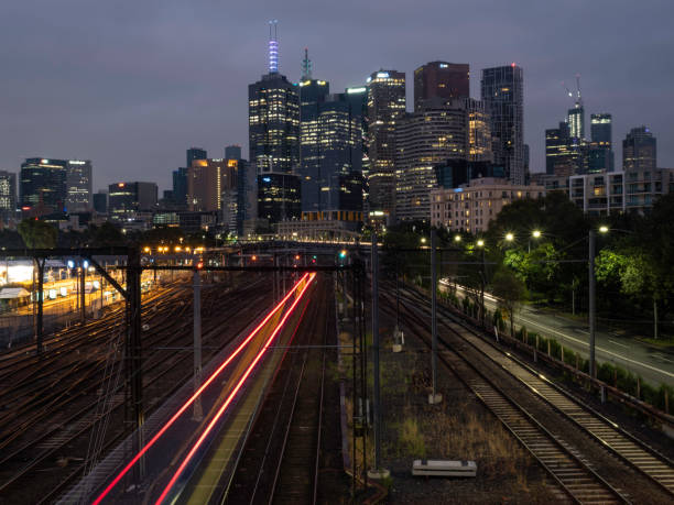 istock Urban skyline and train at night 1460335010