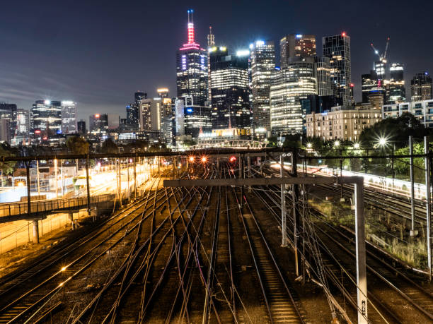 istock City skyline and train tracks at night 1460335297