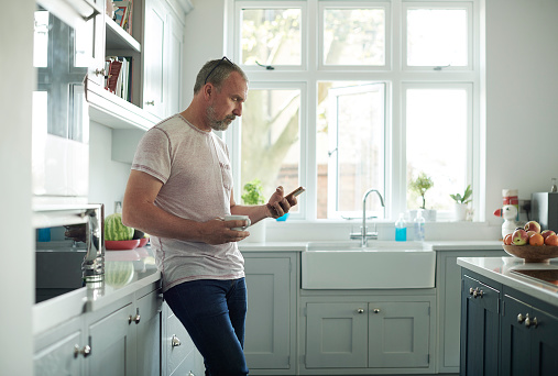 mature man scrolling