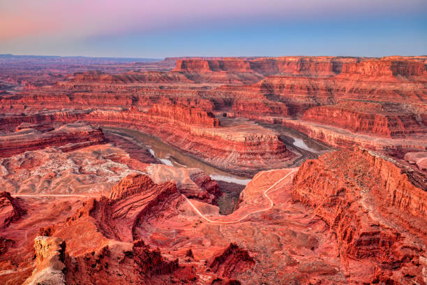 Dead Horse Point at Sunrise Dead Horse Point at Sunrise showing the Colorado River canyonlands national park stock pictures, royalty-free photos & images