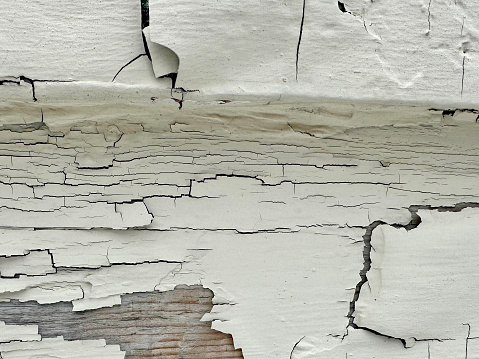 White peeling paint on the wall