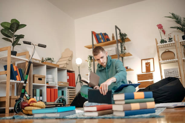 Man studying at home stock photo