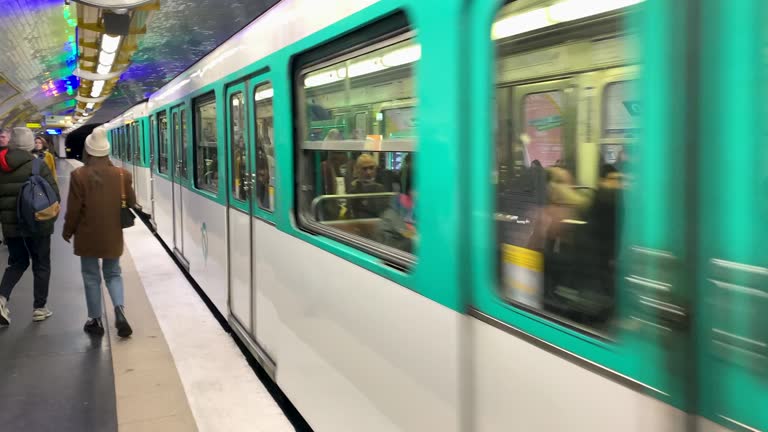 Trains Arriving and Departing at Busy Paris Train Station