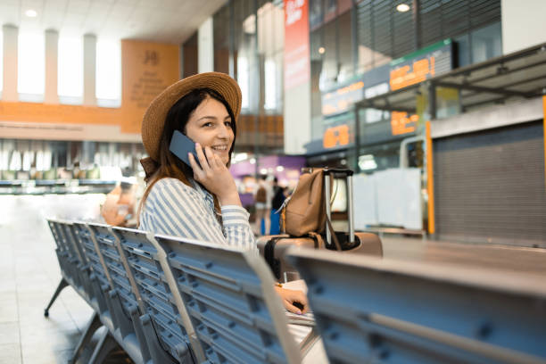 istock Girl on a journey waiting for a train and surfing the net 1460362925