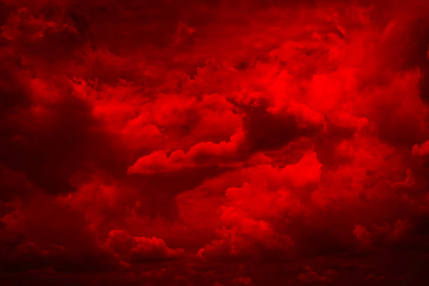 Black blood red fiery sky with clouds. Horror background . Ominous skies. Hell. Black blood red fiery sky with clouds. Horror background for design. Dramatic frightening ominous skies. Hell inferno. Scary, creepy, evil, spooky, eerie. Armageddon apocalypse concept. devil stock pictures, royalty-free photos & images