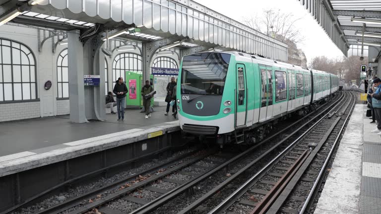 Trains Arriving and Departing at Busy Paris Train Station