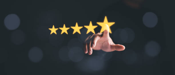 istock Man hand touching on popup five star icon for feedback review satisfaction service, Customer service experience and business satisfaction survey. best quality product and service. 1460369891
