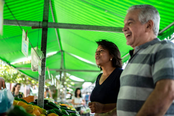 istock Friends talking with someone on a street market 1460371015