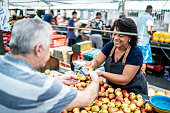 Customer paying with credit card on a street market