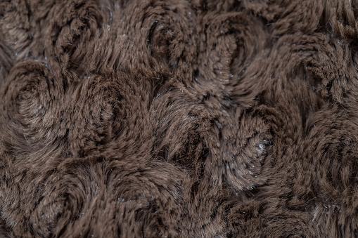 Dark brown fur fabric texture