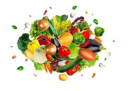 Collection of tasty fresh vegetables mix explosion on an isolated white background.