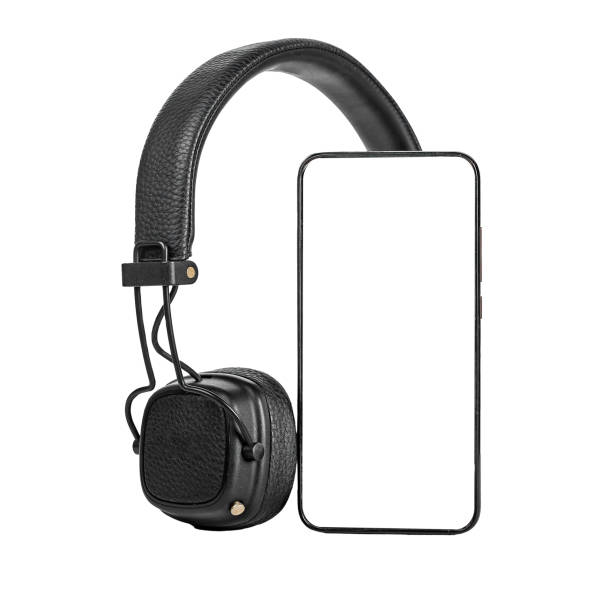 istock Mobile smartphone mockup, headphones isolated on white background. Smart phone screen mock up, template for audio music podcast application promotion 1460381592