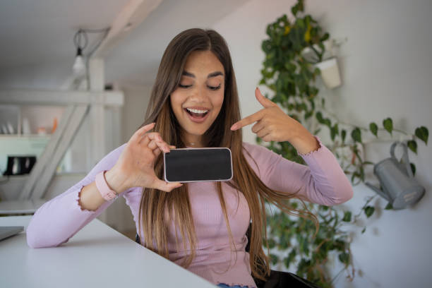 istock Happy young woman using phone 1460384810
