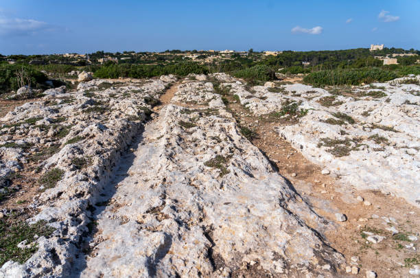 Cart ruts on the island of Malta at Misrah Ghar il-Kbir (Clapham Junction) stock photo