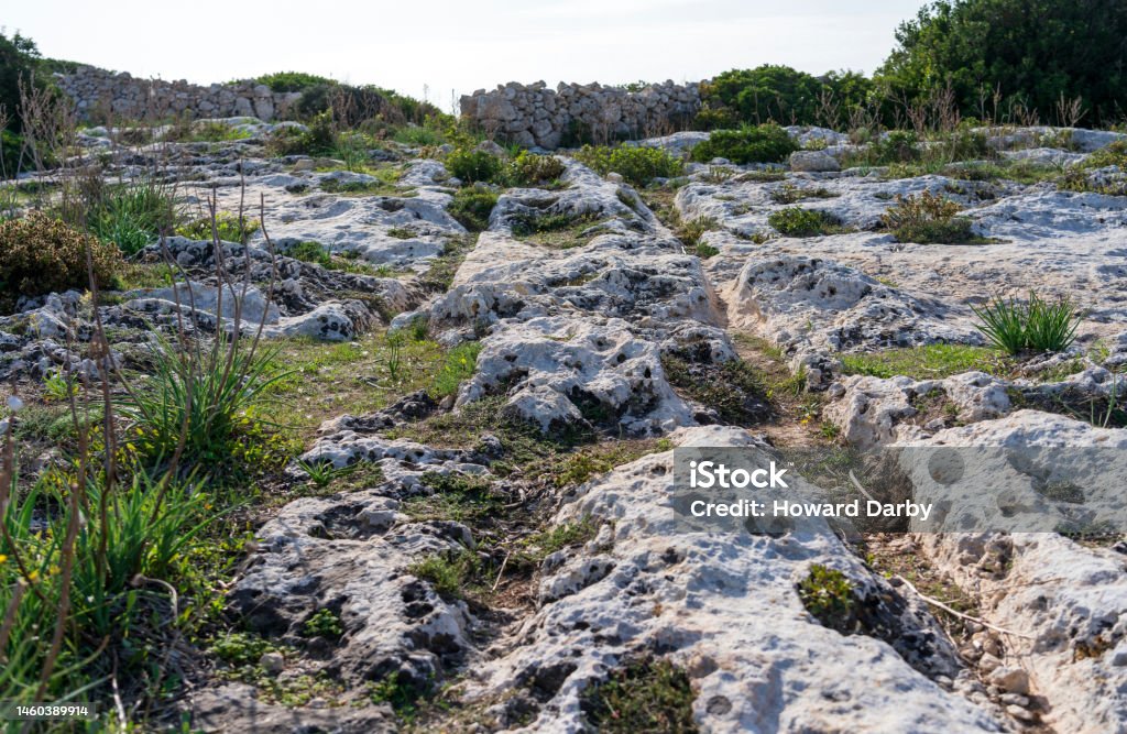 Cart ruts on the island of Malta at Misrah Ghar il-Kbir (Clapham Junction) Picture taken at the Clapham Junction cart ruts Ancient Stock Photo