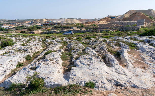Cart ruts on the island of Malta at Misrah Ghar il-Kbir (Clapham Junction) stock photo