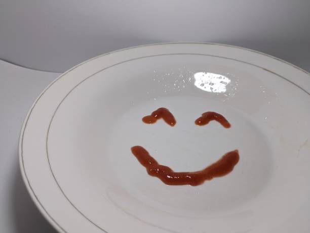 istock smile icon which is on a white plate. made with sauce 1460390490