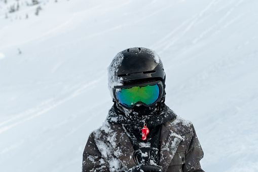 Close-up of a skier in a sports helmet and ski goggles