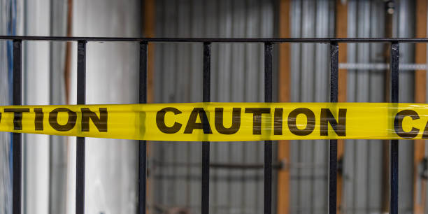 istock Yellow caution tape on stair metal handrails 1460396346