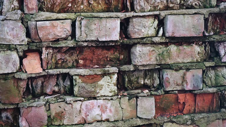 Close-up of the second broken brick wall. The camera moves smoothly and shoots the wall