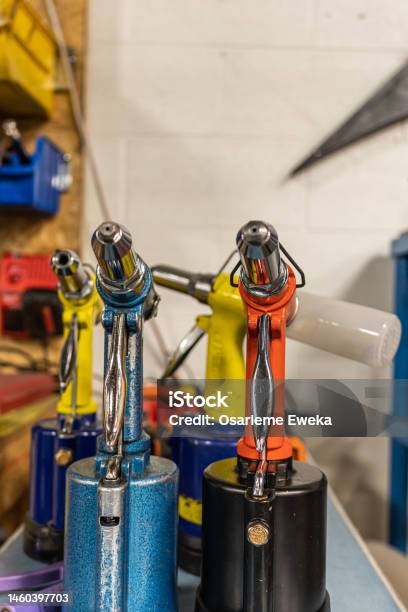 Pneumatic Rivet Guns In A Metal Factory To Fabricate Stock Photo - Download Image Now