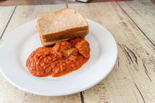 istock Slices of Bread served with nigerian pepper stew 1460401341