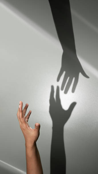 istock Helping Hand, Support or Partnership Concept. Shadow of a Helping Hand for Rescue a Disaster Person. Business and Relationship of People 1460407328