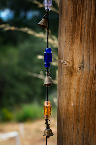 Colorful Windchime On Wooden Garden Post
