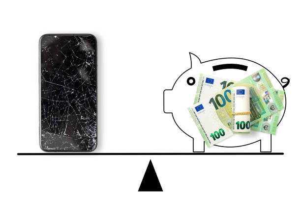 Black broken touch screen phone and 100 euros banknotes on scales. Black broken touch screen phone and 100 euros banknotes on scales. best mobile phone repairs stock pictures, royalty-free photos & images