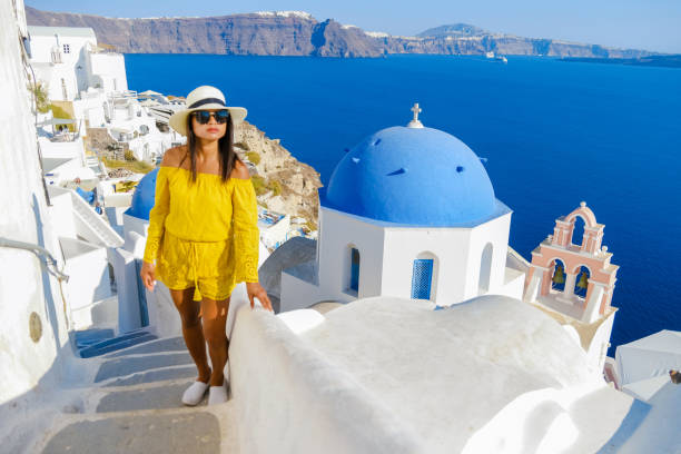 istock Asian women visit Oia Santorini Greece during summer with whitewashed homes and churches 1460423964