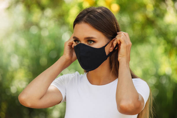 istock Girl in black protective mask 1460434442
