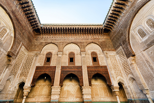 the Court of Lions at the 13th century Alhambra Palace in Granada Spain. Beautiful arches and Arabesque Architecture