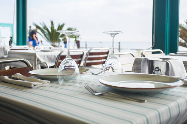 istock Elegant restaurant table with cutlery, crockery and glasses. 1460443330