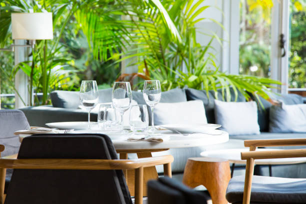 istock Elegant restaurant table with cutlery, crockery and glasses. 1460444124