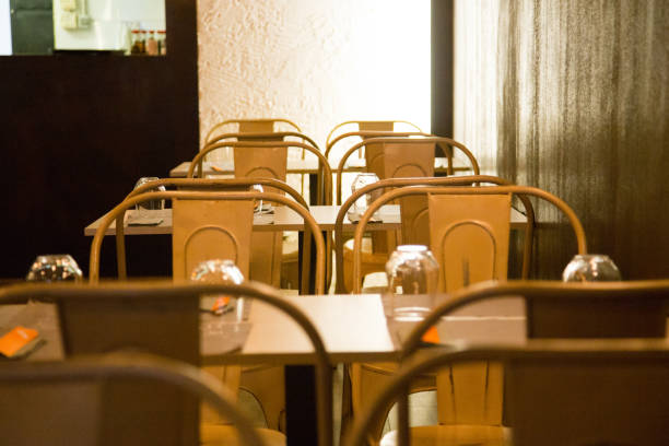 istock Elegant restaurant table with cutlery, crockery and glasses. 1460444229
