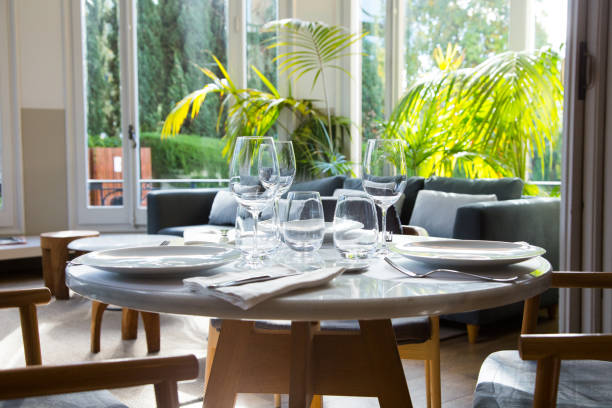 istock Elegant restaurant table with cutlery, crockery and glasses. 1460444230