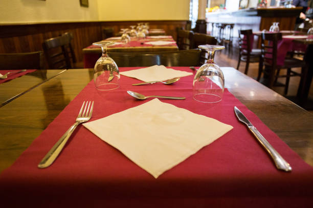 istock Elegant restaurant table with cutlery, crockery and glasses. 1460444627